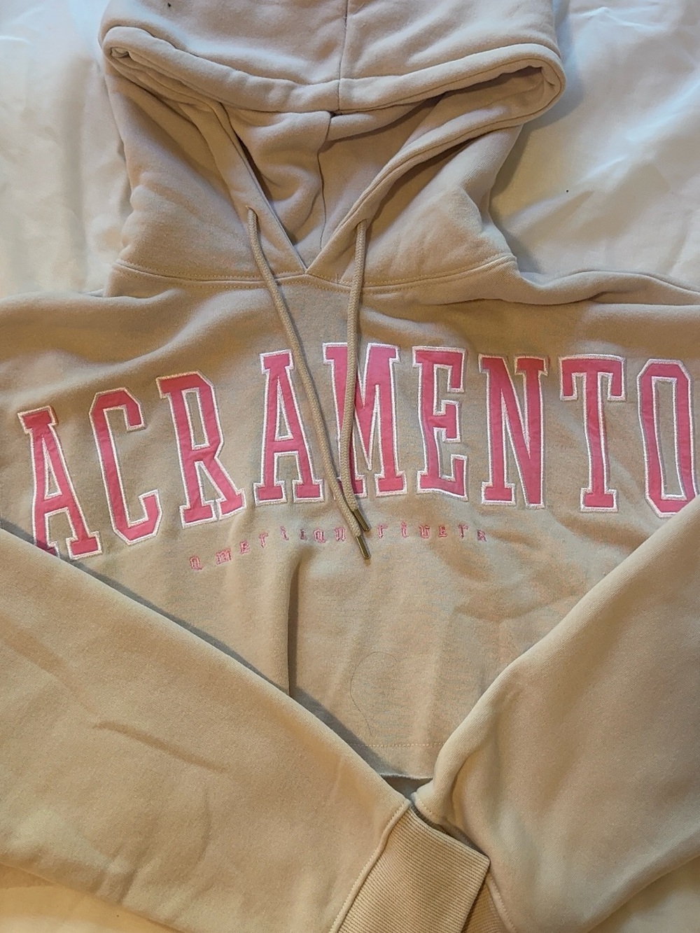 Women’s Sacramento Cropped Hooded Sweatshirt in Tan with Pink Lettering